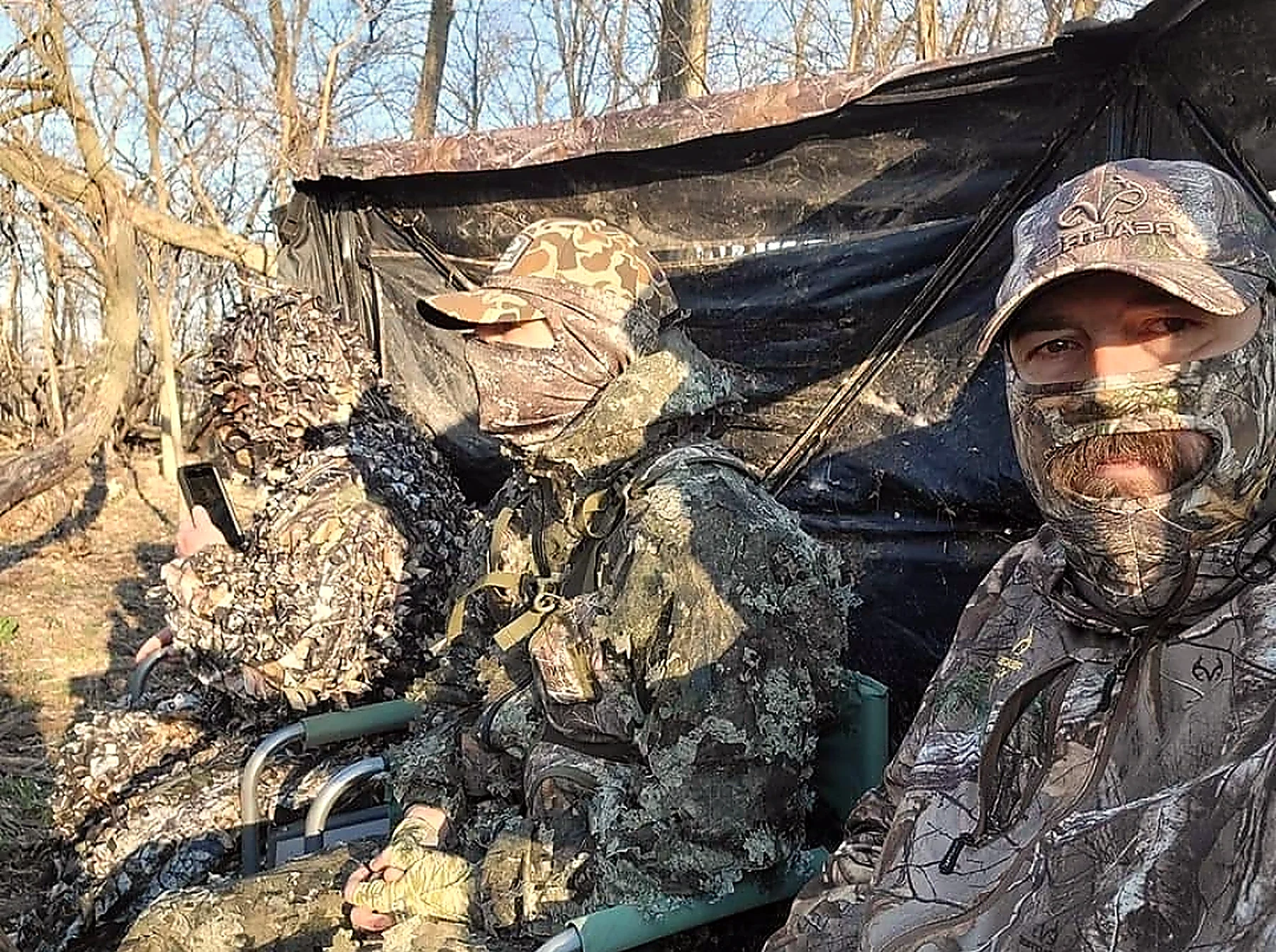 A Bigger Bucks Outfitters guide in a hunting blind in Henderson County Illinois