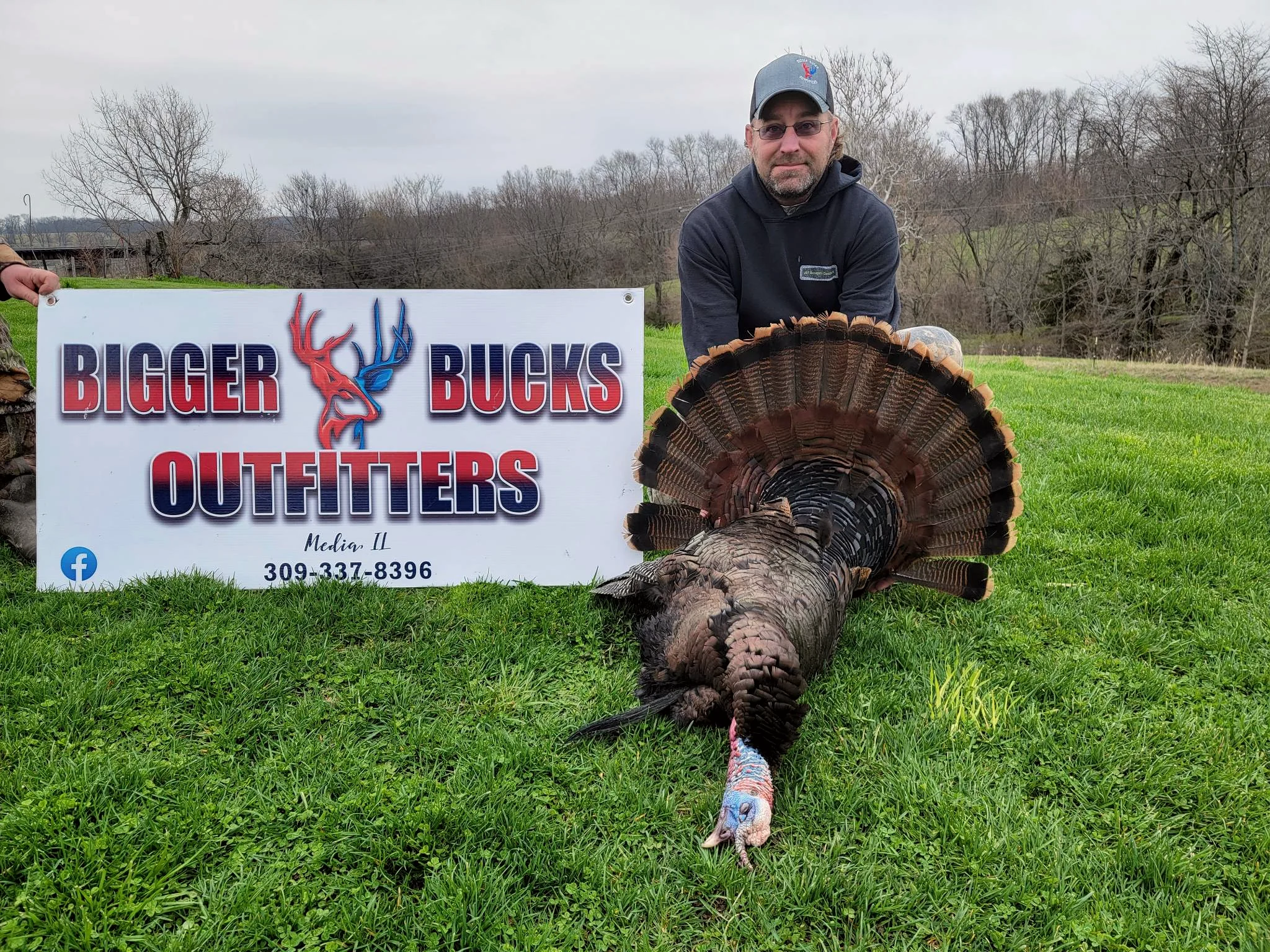 Hunter with a spring gobbler taken at Bigger Bucks Outfitters in Media Illinois
